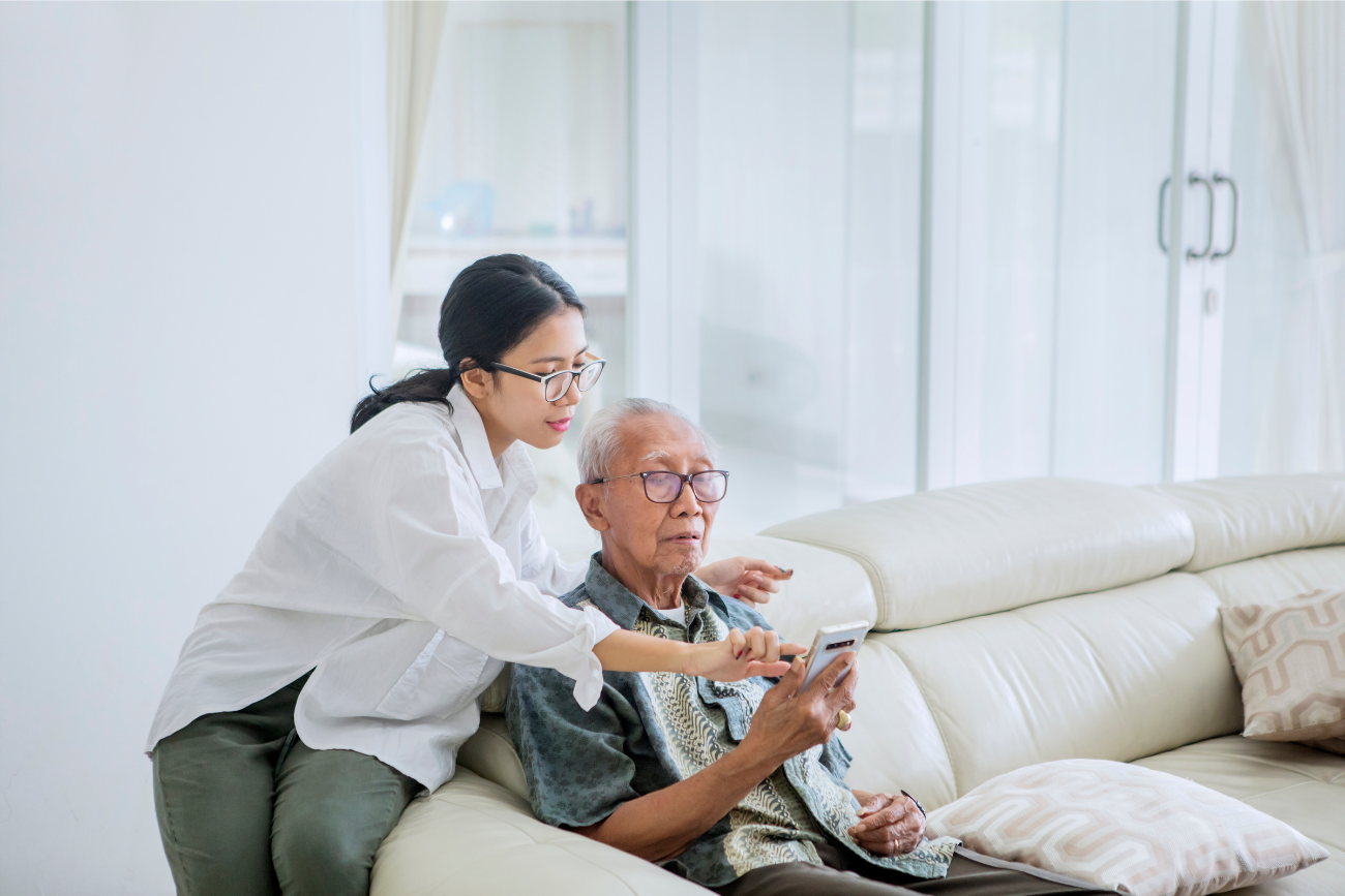 elderly man and family caretaker